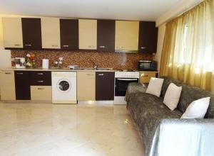 a living room with a couch and a kitchen at Nadia's House 2 in Afantou +7 photos