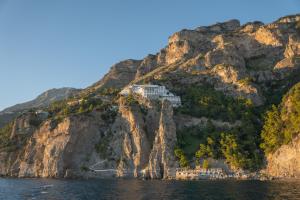 a building on the side of a mountain at Grand Hotel Tritone in Praiano