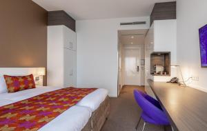 Postel nebo postele na pokoji v ubytování Hotel Lumen Zwolle