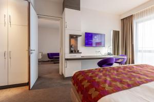 Postel nebo postele na pokoji v ubytování Hotel Lumen Zwolle