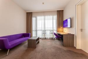 TV a/nebo společenská místnost v ubytování Hotel Lumen Zwolle