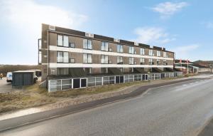 an apartment building on the side of a road at 2 Bedroom Stunning Apartment In Fan in Fanø