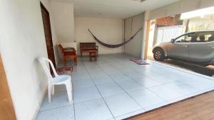 a patio with a car parked in a house at casa pra muito gente in Tibau do Sul