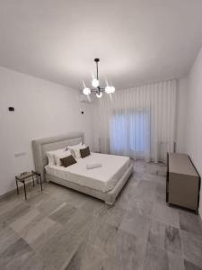 Postel nebo postele na pokoji v ubytování Superbe appartement indépendant à l'entrée de la marsa