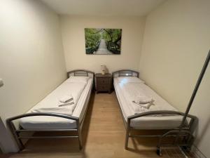 Postel nebo postele na pokoji v ubytování Gästehaus Schmitt