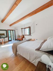 Ένα ή περισσότερα κρεβάτια σε δωμάτιο στο Villa Cerfoglio, pace sulle colline romagnole