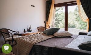 Ένα ή περισσότερα κρεβάτια σε δωμάτιο στο Villa Cerfoglio, pace sulle colline romagnole +10 φωτογραφίες