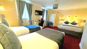 En eller flere senger på et rom på Waterloo Lodge