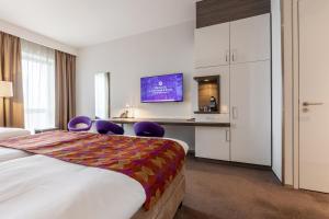 Postel nebo postele na pokoji v ubytování Hotel Lumen Zwolle