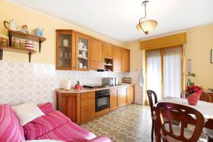 a kitchen with a couch and a table in a room at Maison Blanchet in Sarre