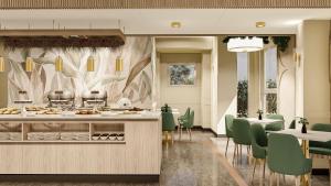 a kitchen with green chairs and a counter with food at Massimi City Garden in Rome