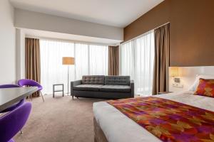 Postel nebo postele na pokoji v ubytování Hotel Lumen Zwolle