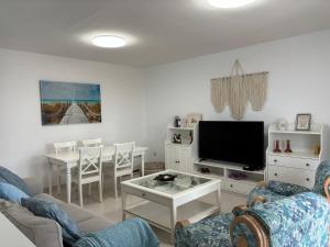 Un televizor și/sau centru de divertisment la Apartamento Guadalupe