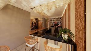 a dining room with a black table and chairs at Casa Tayrona Hostal Boutique in Medellín