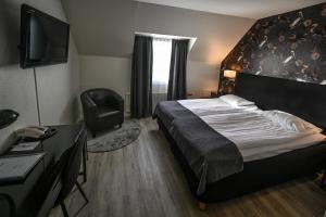 Giường trong phòng chung tại Hotel Amadeus by First