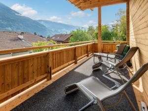 een terras met stoelen en uitzicht op de bergen bij Holiday Home Penz - FGZ151 by Interhome in Pankrazberg