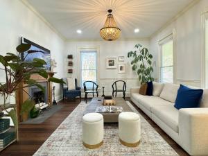 a living room with a couch and a table at Garden on Capital-Bourbon & Horse Country in Frankfort