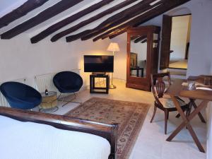 Televízia a/alebo spoločenská miestnosť v ubytovaní Casa Boutique el Capricho Adults Only