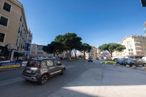 a small car is driving down a city street at 223 - Ma & Ma Luxury Apartment 1 grande - 500metri da mare e spiaggia, vicino alla Baia del Silenzio - PARCHEGGIO GRATIS PRIVATO INCLUSO in Sestri Levante +42 photos