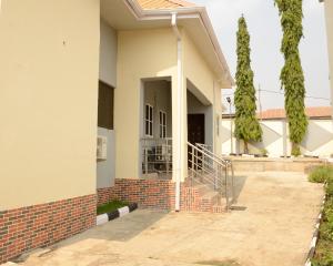 a house with a brick walkway leading to the front door at Peace cottage short lets and apartments in Ibadan