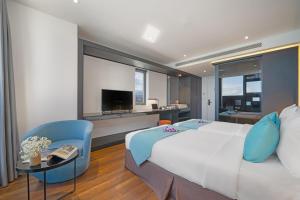 Telewizja i/lub zestaw kina domowego w obiekcie The Code Hotel & Spa Da Nang