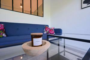 a glass table with a cup on top of it at Functional studio+ Parking close to the tramway in Marquette-lès-Lille