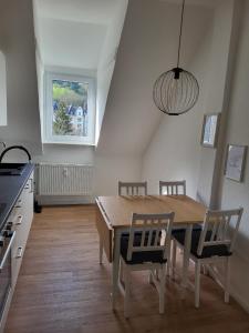 a kitchen and dining room with a table and chairs at Ferienwohnung Jonathan in Koblenz