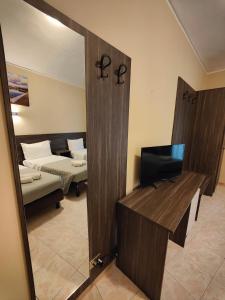 Postel nebo postele na pokoji v ubytování Hotel Romano
