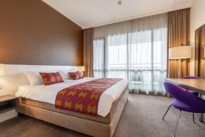 Postel nebo postele na pokoji v ubytování Hotel Lumen Zwolle