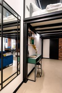 Posteľ alebo postele v izbe v ubytovaní Loft Piotrkowska 37