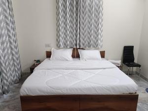 Ένα ή περισσότερα κρεβάτια σε δωμάτιο στο Hotel angels paradise