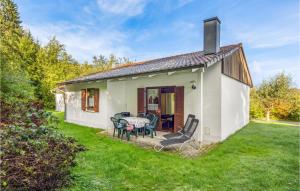 a small white house with a table and chairs at Beautiful Home In Falkenstein With Kitchen in Falkenstein