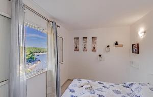 Postel nebo postele na pokoji v ubytování Studio Holiday Home In Tankaraca