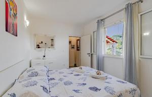 Postel nebo postele na pokoji v ubytování Studio Holiday Home In Tankaraca