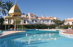 een zwembad voor een groot huis bij Cozy Home In Gran Alacant With Outdoor Swimming Pool in Gran Alacant