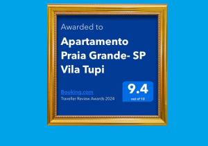 un quadro con il testo assegnato all'apartmentenna praia grande di Apartamento Praia Grande- SP Vila Tupi a Praia Grande