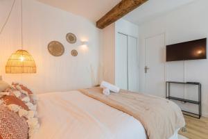 En eller flere senge i et værelse på Old Lille - Functional studio at the Quai du Wault