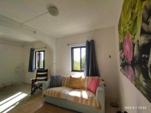 a living room with a couch and a window at Private Pool Fazenda Terrace Villa in Silves +84 photos