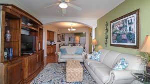 a living room with a couch and a tv at Legacy II 403 in Gulfport