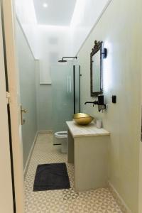 a bathroom with a sink and a toilet at Villa Clio, a Luxury Collection in Thessaloniki