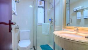 a bathroom with a toilet and a sink and a shower at Pazhou Yi Xiu Boutique Apartment in Guangzhou