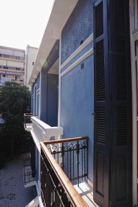 a balcony with a blue wall and a door at Villa Clio, a Luxury Collection in Thessaloniki