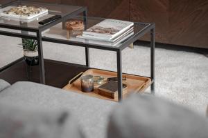 a glass table with books and other items on it at Stylish & recently refurbished Chester apartment - Up to 6 in Chester