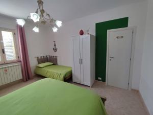 Postel nebo postele na pokoji v ubytování Casetta GGG