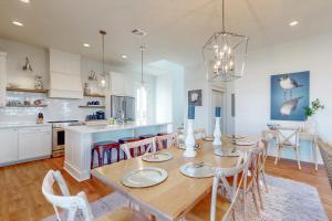 a kitchen and dining room with a table and chairs at Sunset Bay in Galveston