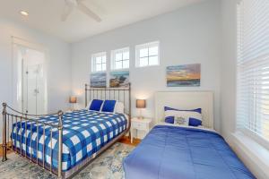 a bedroom with two beds next to a window at Sunset Bay in Galveston
