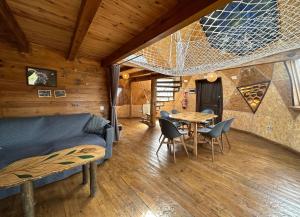 a living room with a couch and a table at Xalet De Prades in Prades