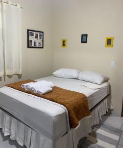 Łóżko lub łóżka w pokoju w obiekcie Casa Aconchego