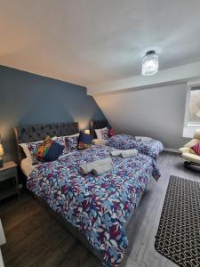 a bedroom with two beds with pillows on it at Sutton Apartment, Greater London in Sutton