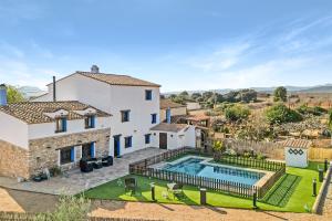 an aerial view of a house with a swimming pool at Luxe Mediterranean Masia BBQ Pool Chillout in Mas de Catalá